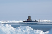 North Polar Region (Apr. 19, 2004) - The Royal Navy Trafalgar class attack submarine HMS Tireless sits on the surface of the North Pole. Tireless surfaced with the U.S. Navy Los Angeles-class attack submarine USS Hampton (SSN 767) for ICEX 04, a joint operational exercise beneath the polar ice cap. Both the Tireless and Hampton crews met on the ice, including scientists traveling aboard both submarines to collect data and perform experiments. The Ice Exercise demonstrates the U.S. and British Submarine Force's ability to freely navigate in all international waters, including the Arctic. U.S. Navy photo by Chief Journalist Kevin Elliott. (RELEASED) 