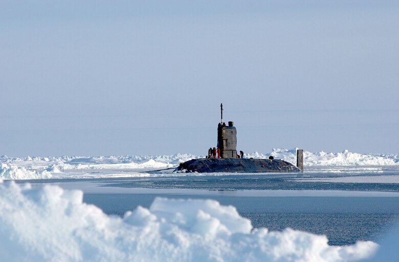 North Polar Region (Apr. 19, 2004) - The Royal Navy Trafalgar class attack submarine HMS Tireless sits on the surface of the North Pole. Tireless surfaced with the U.S. Navy Los Angeles-class attack submarine USS Hampton (SSN 767) for ICEX 04, a joint operational exercise beneath the polar ice cap. Both the Tireless and Hampton crews met on the ice, including scientists traveling aboard both submarines to collect data and perform experiments. The Ice Exercise demonstrates the U.S. and British Submarine Force's ability to freely navigate in all international waters, including the Arctic. U.S. Navy photo by Chief Journalist Kevin Elliott. (RELEASED) 