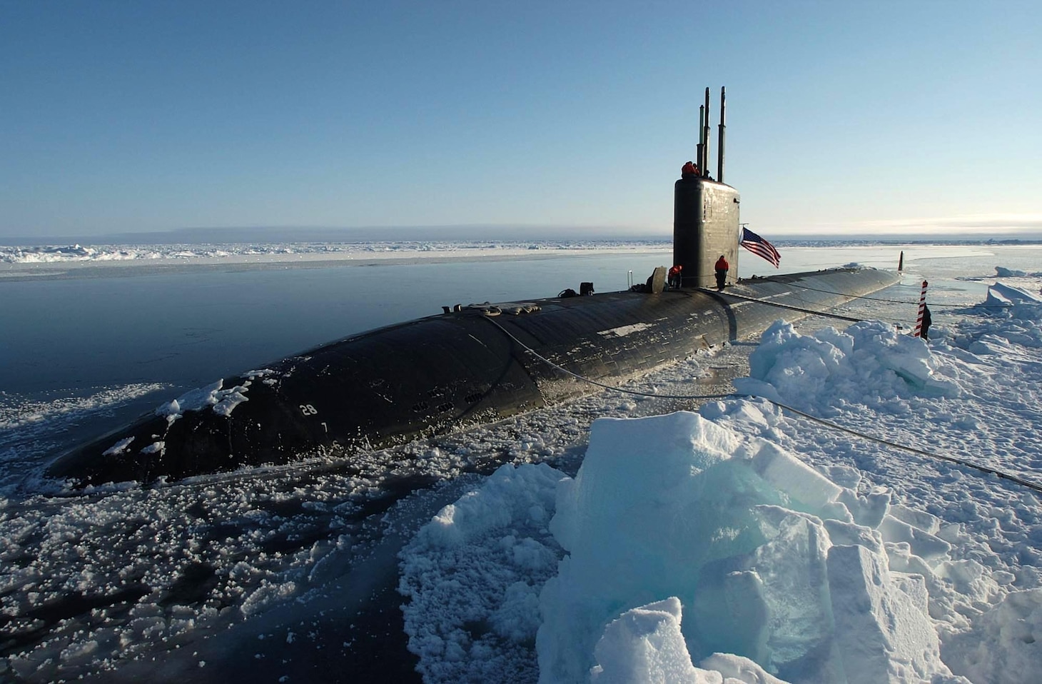 The Los Angeles-class attack submarine USS Hampton (SSN 767) surfaced at the North Pole. Hampton and the Royal Navy Trafalgar class attack submarine HMS Tireless took part in ICEX 04, a joint operational exercise beneath the polar ice cap. Both the Tireless and Hampton crews met on the ice, including scientists traveling aboard both submarines to collect data and perform experiments. The Ice Exercise demonstrates the U.S. and British Submarine Force's ability to freely navigate in all international waters, including the Arctic. U.S. Navy photo by Chief Journalist Kevin Elliott. (RELEASED) 