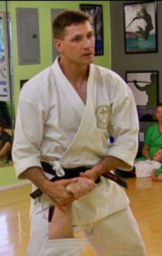 Lt. Col. Gregory Rooker, provost marshal for Marine Corps Air Station Miramar, Calif., teaches knife defenses during a karate seminar in Tennessee in 2011. Rooker holds a sixth-degree black belt in karate after 31 years of studying the style.