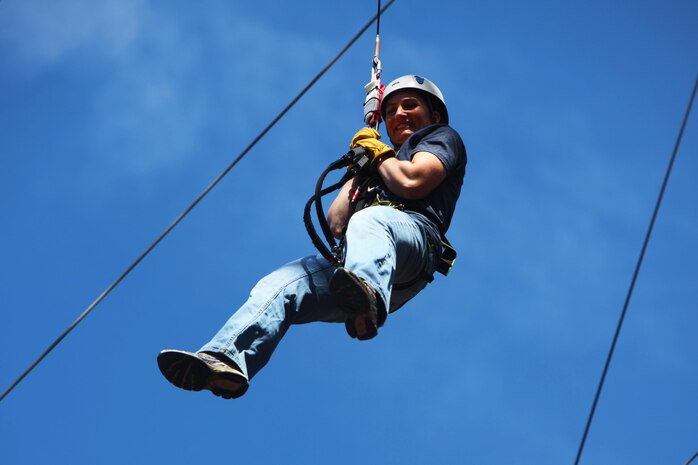 Col. Wendy J. Goyette descends from a 65-foot free fall tower during the Devil Dog Dare Challenge Course at Marine Corps Air Station Cherry Point, N.C., March 10, 2016. The Devil Dog Dare Challenge Course was designed for Marines and Sailors to get engaged in Operation Adrenaline Rush. OAR is a training tool designed to introduce Marines to activities that serve as alternatives to uncharacteristic behaviors often associated with incidents involving recently deployed Marines. Goyette is the assistant chief of staff, G-6, 2nd Marine Aircraft Wing. (U.S. Marine Corps photo by Pfc. Nicholas P. Baird/Released)