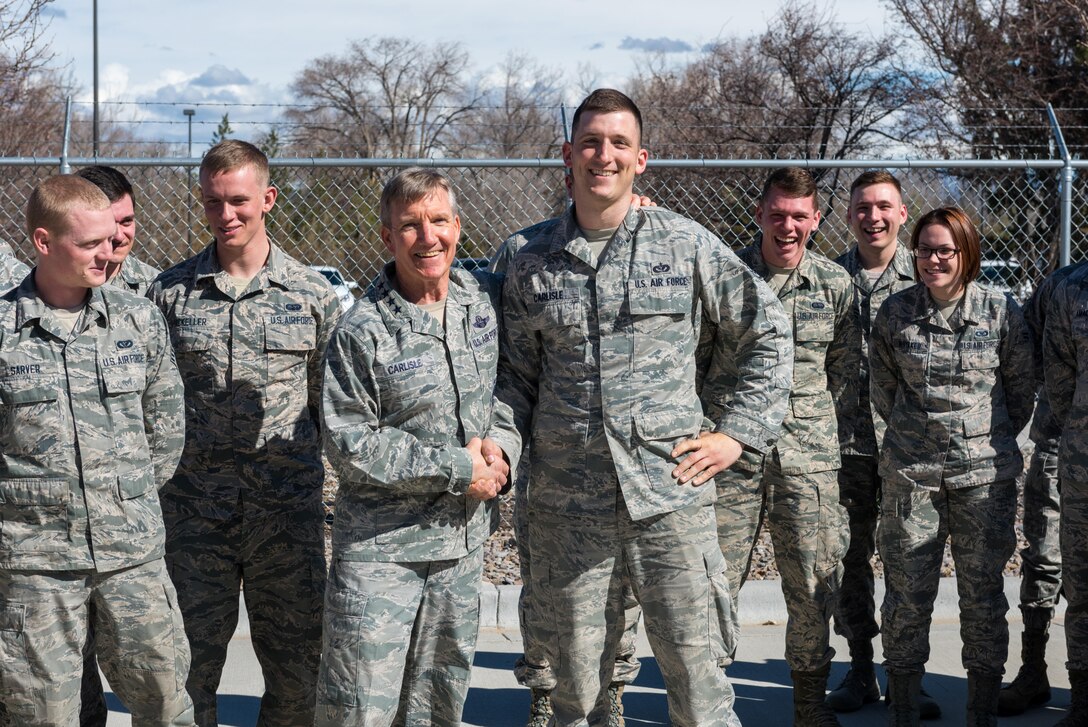 U.S. Air Force Gen. Hawk Carlisle, commander of Air Combat Command, shakes hands with Staff Sgt. Jared Carlisle, 726th Air Control Squadron, quality assurance evaluator at Mountain Home Air Force Base, Idaho, March 7, 2016. Gen. Carlisle joked with Staff Sgt. Carlisle when he realized they shared the same name. (U.S. Air Force photo by Airman 1st Class Connor J. Marth/Released)