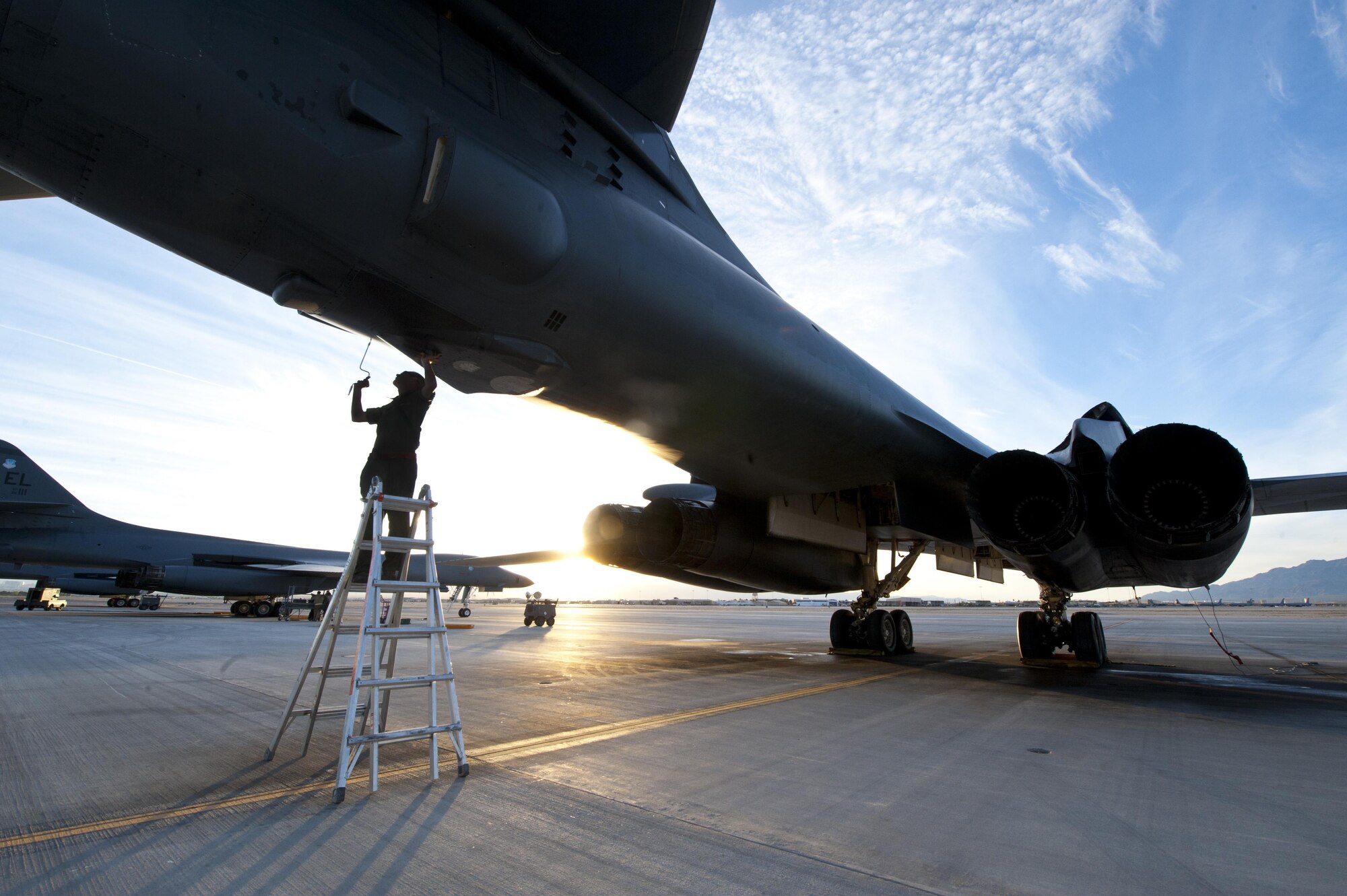 Staff Sgt. Joshua Free, a dedicated crew chief assigned to the 28th Aircraft Maintenance Squadron, Ellsworth Air Force Base, S.D., performs aircraft structure checks on a B-1 Lancer prior to a Red Flag 16-2 night training sortie March, 10, 2016 at Nellis Air Force Base, Nev. A high operations tempo presents an additional challenge faced by aircraft maintainers during Red Flag exercises, where consistent attention to detail is of vital importance. (U.S. Air Force photo by Senior Airman Joshua Kleinholz)