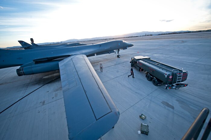 Aircraft maintainers assigned to the 28th Aircraft Maintenance Squadron, Ellsworth Air Force Base, S.D., assist Airmen from the 99th Logistics Readiness Squadron, Nellis AFB, Nev., refuel a B-1 Lancer prior to a Red Flag 16-2 night training sortie March, 10, 2016 at Nellis Air Force Base, Nev. Red Flag exercises can be home to more than 100 U.S. Air Force, joint and coalition aircraft; all requiring large amounts of fuel. (U.S. Air Force photo by Senior Airman Joshua Kleinholz)