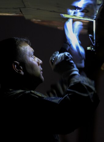 A Turkish air force maintainer checks an F-16 Fighting Falcon on the flightline before take-off during Red Flag 16-2 night operations at Nellis Air Force Base, Nev., March 4, 2016. Red Flag is an exercise hosted at Nellis AFB, Nev., that provides aircrews an opportunity to experience realistic, stressful combat situations in a controlled environment to increase mission capability. (U.S. Air Force photo by Airman 1st Class Kevin Tanenbaum) 