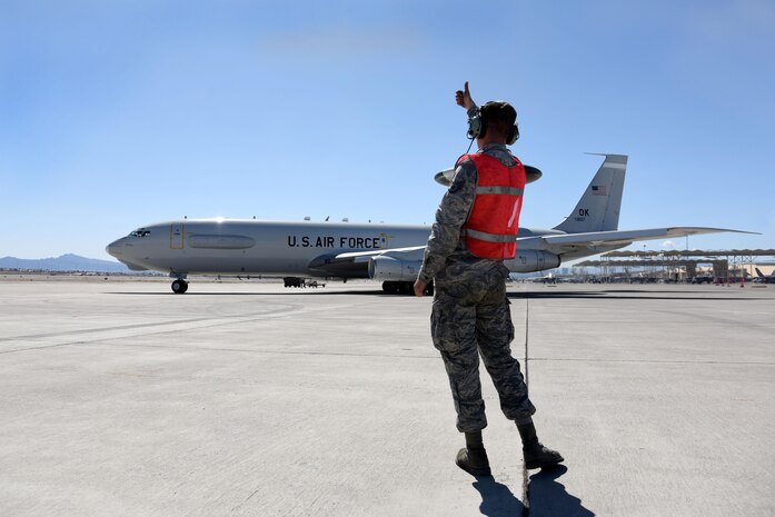 Staff Sgt. Christopher Longueira, 552nd Aircraft Maintenance Squadron dedicated crew chief, gives a "thumbs up" to the aircrew on an E-3 Sentry March 8, 2016, during Red Flag 16-2 at Nellis Air Force Base, Nevada. It takes a crew of more than 20 Airmen to accomplish multiple command and control tasks for each E-3 mission. (U.S. Air Force photo/Staff Sgt. Chuck Broadway)