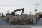 160310-N-HA376-210 JINHAE, Republic of Korea (March 9, 2016) - U.S. Navy and Republic of
Korea (ROK) Seabees place concrete block and move aggregate during exercise Foal Eagle
2016. The Seabees, assigned to Naval Mobile Construction Battalion (NMCB) 4, and ROK
Seabees are training together at the ROK Engineering School during the exercise. Foal Eagle is an annual, bilateral training exercise designed to enhance the readiness of U.S. and ROK forces, and their ability to work together during a crisis. (U.S. Navy photo by Chief Mass Communication Specialist Lowell Whitman/Released)