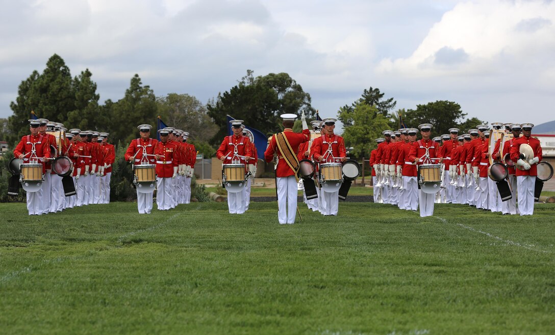 Marines with the United States Marine Drum and Bugle Corps, “the Commandant’s Own” perform during the Battle Color Ceremony aboard Marine Corps Air Station Miramar, Calif., March 11. The Battle Color Detachment is a ceremonial unit featuring the United States Marine Drum and Bugle Corps, the Silent Drill Platoon and the official Marine Corps Color Guard. “The Drum and Bugle Corps, and the Silent Drill Platoon puts on a fantastic show, ‘wows’ the crowd and represents the best the Marine Corps has to offer,” said Maj. Gen. Michael Rocco, commanding general of the 3rd Marine Aircraft Wing. The Battle Color Detachment is based out of Marine Barracks Washington, also known as “8th and I,” the oldest active post in the Marine Corps. The Marines in the detachment perform in hundreds of ceremonies across the country annually. (U.S. Marine Corps photo by Cpl. Kimberlyn Adams/Released)