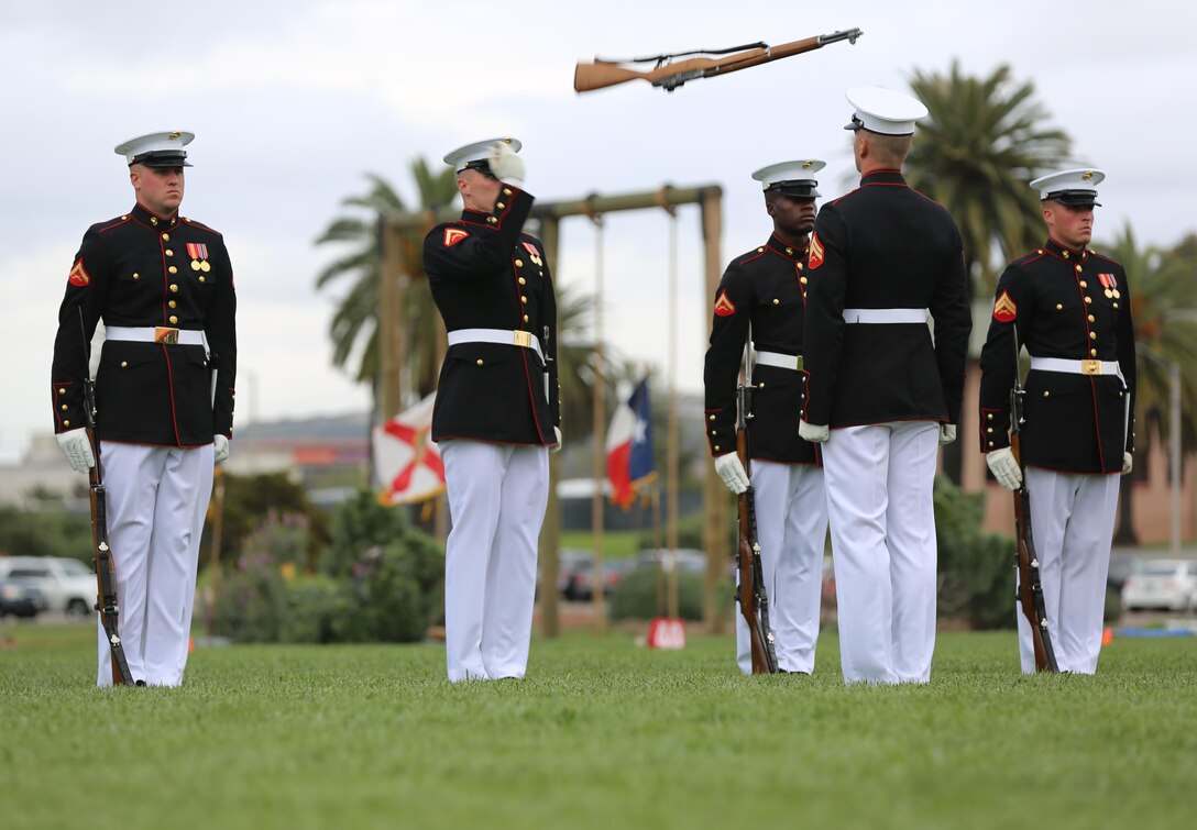 Marines with the Silent Drill Platoon perform their signature routine during the Battle Color Ceremony aboard Marine Corps Air Station Miramar, Calif., March 11. The Battle Color Detachment is a ceremonial unit featuring the United States Marine Drum and Bugle Corps, the Silent Drill Platoon and the official Marine Corps Color Guard. “The Drum and Bugle Corps, and the Silent Drill Platoon puts on a fantastic show, ‘wows’ the crowd and represents the best the Marine Corps has to offer,” said Maj. Gen. Michael Rocco, commanding general of the 3rd Marine Aircraft Wing. The Battle Color Detachment is based out of Marine Barracks Washington, also known as “8th and I,” the oldest active post in the Marine Corps. The Marines in the detachment perform in hundreds of ceremonies across the country annually. (U.S. Marine Corps photo by Cpl. Kimberlyn Adams/Released)