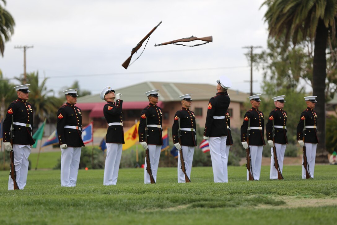 Marines with the Silent Drill Platoon perform their signature routine during the Battle Color Ceremony aboard Marine Corps Air Station Miramar, Calif., March 11. The Battle Color Detachment is a ceremonial unit featuring the United States Marine Drum and Bugle Corps, the Silent Drill Platoon and the official Marine Corps Color Guard. “The Drum and Bugle Corps, and the Silent Drill Platoon puts on a fantastic show, ‘wows’ the crowd and represents the best the Marine Corps has to offer,” said Maj. Gen. Michael Rocco, commanding general of the 3rd Marine Aircraft Wing. The Battle Color Detachment is based out of Marine Barracks Washington, also known as “8th and I,” the oldest active post in the Marine Corps. The Marines in the detachment perform in hundreds of ceremonies across the country annually. (U.S. Marine Corps photo by Cpl. Kimberlyn Adams/Released)