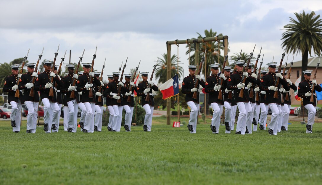 Marines with the Silent Drill Platoon perform during the Battle Color Ceremony aboard Marine Corps Air Station Miramar, Calif., March 11. The Battle Color Detachment is a ceremonial unit featuring the United States Marine Drum and Bugle Corps, the Silent Drill Platoon and the official Marine Corps Color Guard. “The Drum and Bugle Corps, and the Silent Drill Platoon puts on a fantastic show, ‘wows’ the crowd and represents the best the Marine Corps has to offer,” said Maj. Gen. Michael Rocco, commanding general of the 3rd Marine Aircraft Wing. The Battle Color Detachment is based out of Marine Barracks Washington, also known as “8th and I,” the oldest active post in the Marine Corps. The Marines in the detachment perform in hundreds of ceremonies across the country annually. (U.S. Marine Corps photo by Cpl. Kimberlyn Adams/Released)