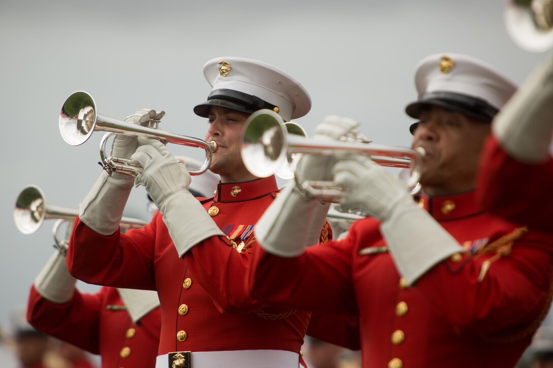 Marines with the United States Marine Drum and Bugle Corps perform aboard Marine Corps Air Station Miramar, Calif., March 11. These Marines wear red jackets which sets them apart from other bands in the Marine Corps. (U.S. Marine Corps photo by Sgt. Lillian Stephens/Released)