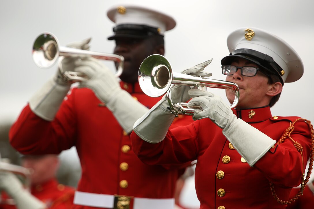Marines with the United States Marine Drum and Bugle Corps perform aboard Marine Corps Air Station Miramar, Calif., March 11. These Marines wear red jackets which sets them apart from other bands in the Marine Corps. (U.S. Marine Corps photo by Sgt. Lillian Stephens/Released)