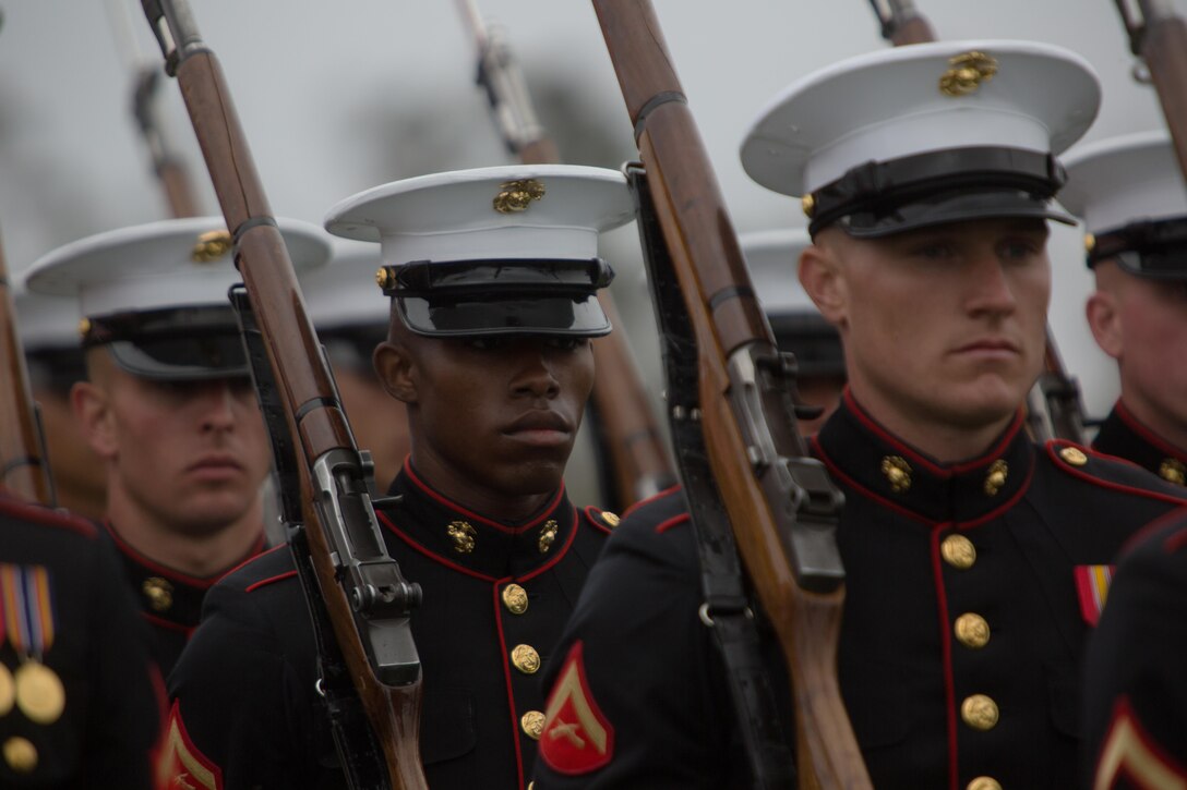 Marines with The Silent Drill Platoon march off of the parade deck aboard Marine Corps Air Station Miramar, Calif., March 11. Their performance was part of a Battle Color Ceremony aboard the air station. (U.S. Marine Corps photo by Sgt. Lillian Stephens/Released)