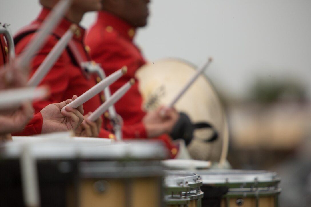 Marines with the United States Marine Drum and Bugle Corps perform while leaving the parade deck aboard Marine Corps Air Station Miramar, Calif., March 11. These Marines wear red jackets which sets them apart from other bands in the Marine Corps. (U.S. Marine Corps photo by Sgt. Lillian Stephens/Released)
