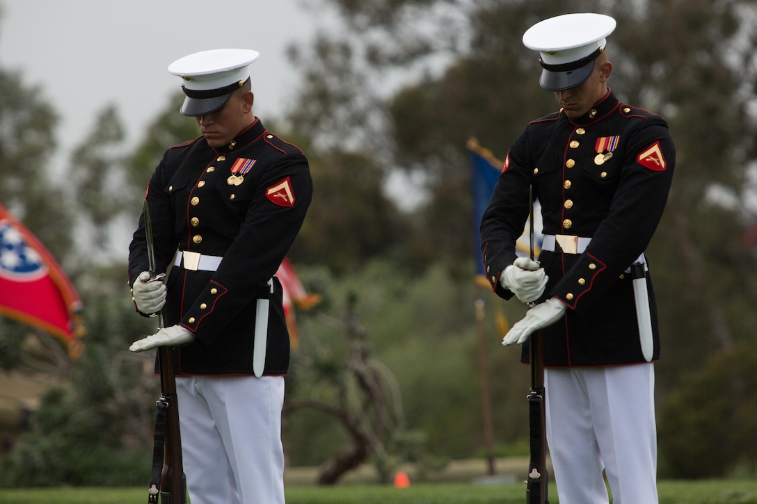 Marines with the Silent Drill Platoon affix bayonets to their rifles during a performance aboard Marine Corps Air Station Miramar, Calif., March 11. Their performance was part of the Battle Color Ceremony aboard the air station. (U.S. Marine Corps photo by Sgt. Lillian Stephens/Released)