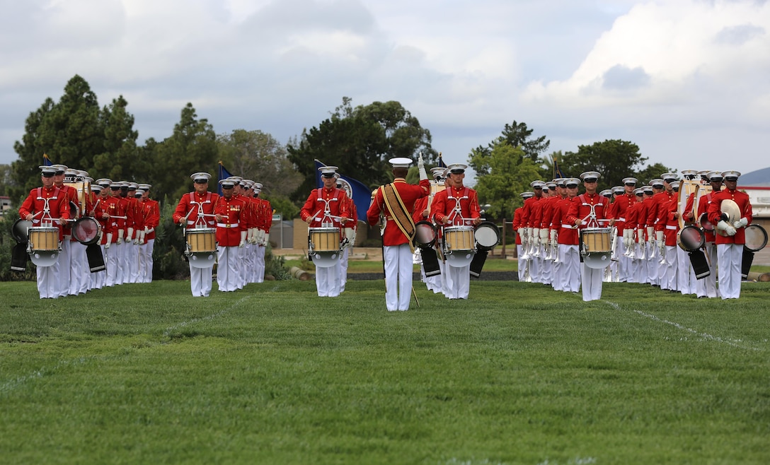 Marines with the United States Marine Drum and Bugle Corps, “the Commandant’s Own” perform during the Battle Color Ceremony aboard Marine Corps Air Station Miramar, Calif., March 11. The Battle Color Detachment is a ceremonial unit featuring the United States Marine Drum and Bugle Corps, the Silent Drill Platoon and the official Marine Corps Color Guard. “The Drum and Bugle Corps, and the Silent Drill Platoon puts on a fantastic show, ‘wows’ the crowd and represents the best the Marine Corps has to offer,” said Maj. Gen. Michael Rocco, commanding general of the 3rd Marine Aircraft Wing. The Battle Color Detachment is based out of Marine Barracks Washington, also known as “8th and I,” the oldest active post in the Marine Corps. The Marines in the detachment perform in hundreds of ceremonies across the country annually. (U.S. Marine Corps photo by Cpl. Kimberlyn Adams/Released)