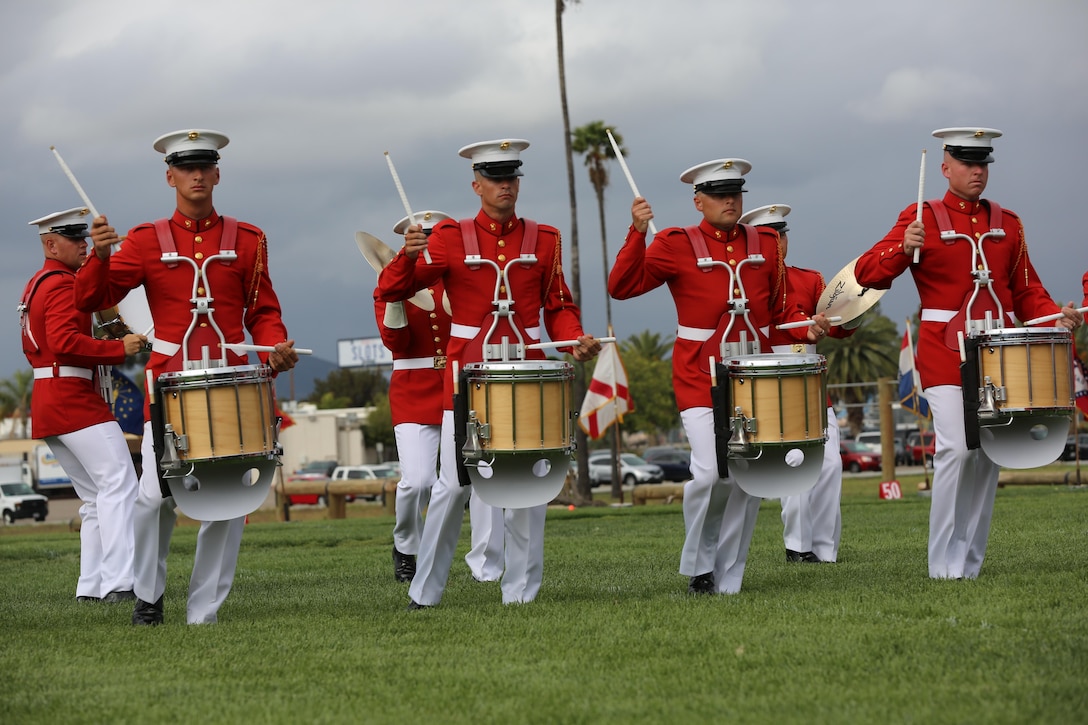 Marines with the United States Marine Drum and Bugle Corps, “the Commandant’s Own” perform during the Battle Color Ceremony aboard Marine Corps Air Station Miramar, Calif., March 11. The Battle Color Detachment is a ceremonial unit featuring the United States Marine Drum and Bugle Corps, the Silent Drill Platoon and the official Marine Corps Color Guard. “The Drum and Bugle Corps, and the Silent Drill Platoon puts on a fantastic show, ‘wows’ the crowd and represents the best the Marine Corps has to offer,” said Maj. Gen. Michael Rocco, commanding general of the 3rd Marine Aircraft Wing. The Battle Color Detachment is based out of Marine Barracks Washington, also known as “8th and I,” the oldest active post in the Marine Corps. The Marines in the detachment perform in hundreds of ceremonies across the country annually. (U.S. Marine Corps photo by Cpl. Kimberlyn Adams/Released)