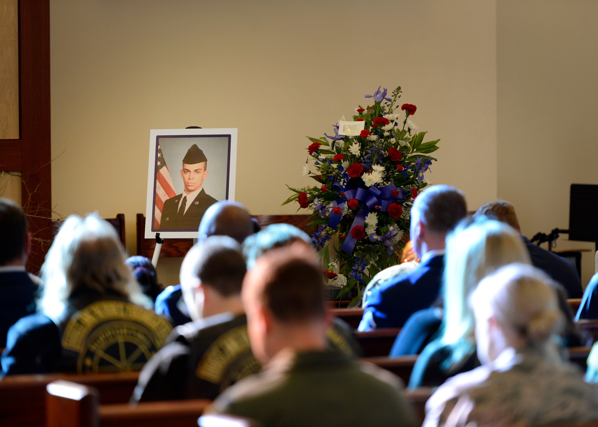 Team Dover gathers to remember Senior Airman Keifer C. Huhman at a memorial service held at the base chapel March 11, 2016, on Dover Air Force Base, Del. Huhman was a cyber surety journeyman assigned to the 436th Communications Squadron. (U.S. Air Force photo/Tech. Sgt. Elizabeth Morris)