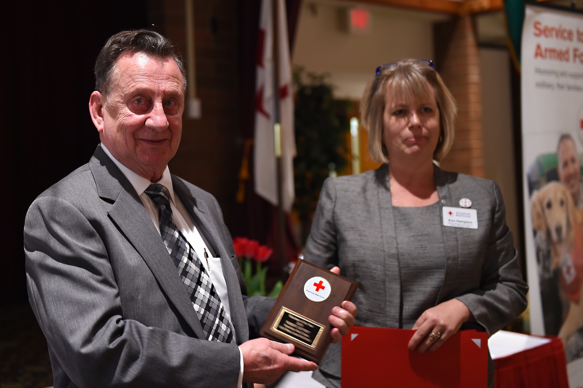 Bob Jeffrey is recognized as the 2015 Volunteer of the Year during the Joint Base Lewis-McChord Annual Volunteer Recognition Luncheon and Award Ceremony at the McChord Club, JBLM, Wash., March 9, 2016. Jeffrey who arrived at JBLM in 1979 as a senior master sergeant, has served as the Red Cross Coordinator at the McChord Clinic for more than 15 years. (U.S. Air Force photo/Staff Sgt. Naomi Shipley)