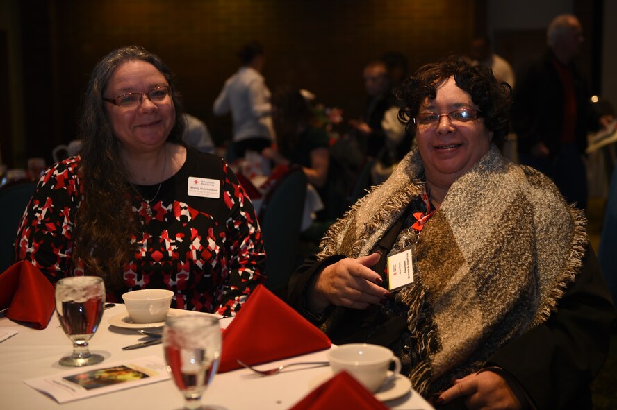 (From left) Shelly Hutchinson and Ashanti Wright, both Red Cross volunteers, attend the Joint Base Lewis-McChord Annual Volunteer Recognition Luncheon and Award Ceremony at the McChord Club, JBLM, Wash., March 9, 2016. In 2015, 315 Red Cross volunteers worked with JBLM healthcare facilities and other service areas to provide support that is essential to the comfort and medical care of service members, Veterans and family members. (U.S. Air Force photo/Staff Sgt. Naomi Shipley)