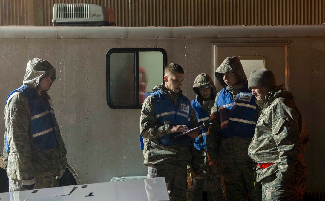 Airmen from the 7th Logistics Readiness Squadron go through a checklist for a low-pressure air compressor Feb. 23, 2016, at Dyess Air Force Base, Texas, during the first-ever B-1 Block 16 Combat Mission Effectiveness exercise. The exercise challenged Airmen from the 7th LRS to quickly and accurately process cargo in a short amount of time. (U.S. Air Force photo by Airman 1st Class Austin Mayfield/Released)