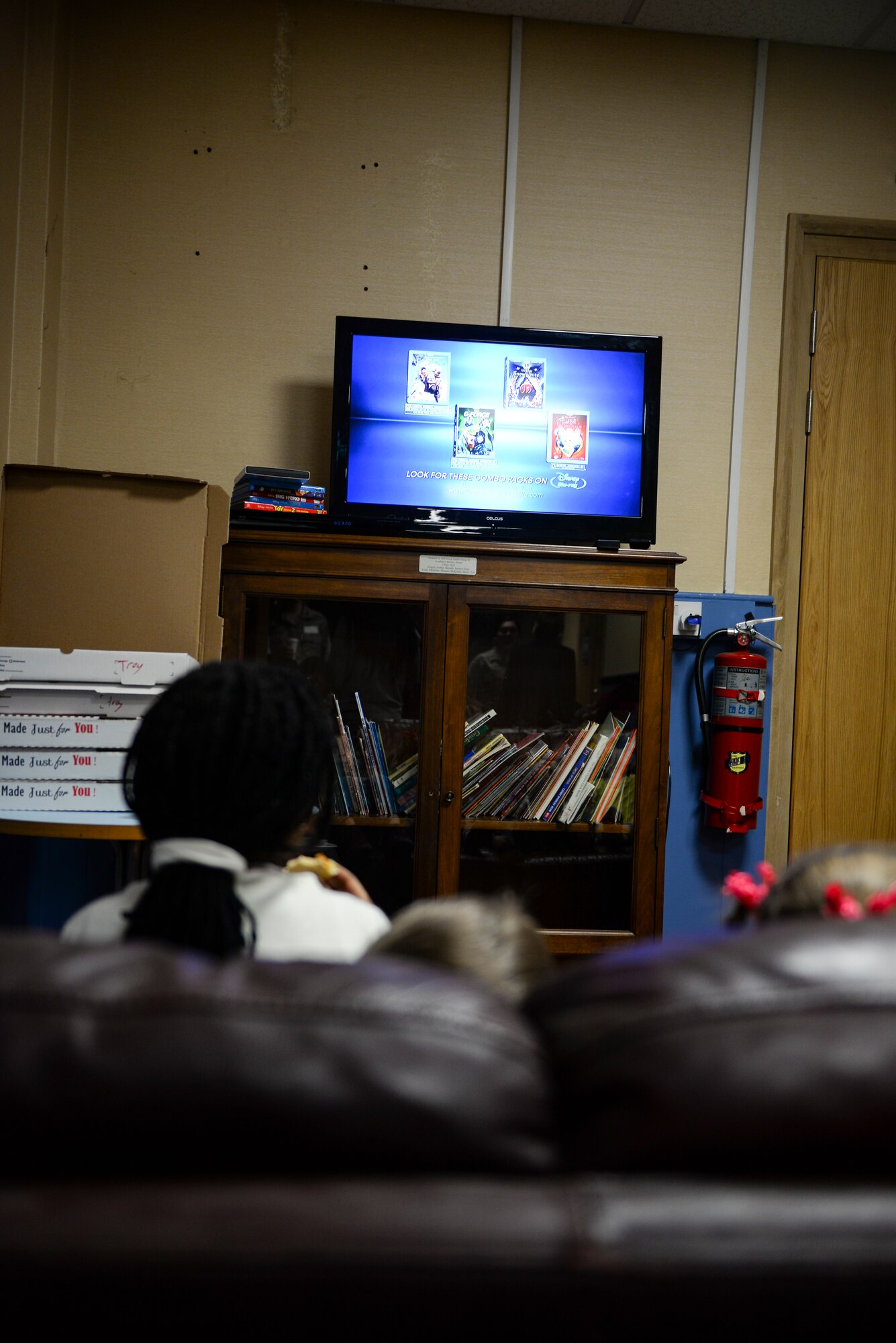 Children watch a movie during a Hearts Apart event for families of deployed Airmen March 10, 2016, at the Bob Hope Community Center on RAF Mildenhall, England. The RAF Mildenhall Top Three Fellowship provided movies and pizza for the children to allow their parents time to socialize and paint. (U.S. Air Force photo by Staff Sgt. Micaiah Anthony/Released)
