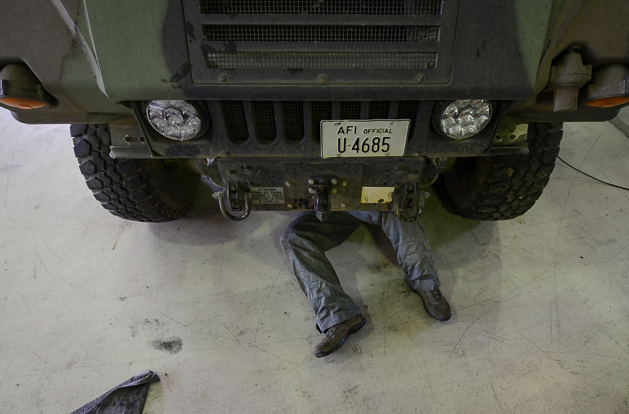 Senior Airman David Ramsey, 31st Logistics Readiness Squadron vehicle maintenance journeyman, performs maintenance on a Humvee March 2, 2015, at Aviano Air Base, Italy. The vehicle maintenance flight is responsible for inspecting, repairing, modifying and accounting for all Government-Owned Vehicles registered to Aviano. (U.S. Air Force photo by Airman 1st Class Cory W. Bush/Released)