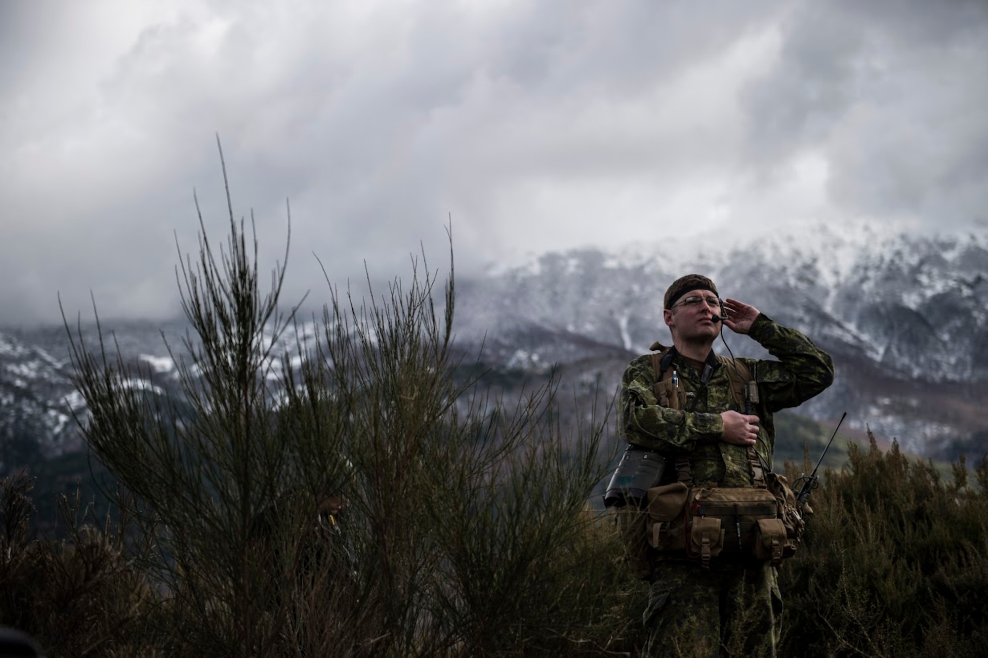Sgt. Lane Starling, 1st Regiment, Royal Canadian Horse Artillery joint terminal attack controller, scans the area and speaks to a pilot as part of a JTAC training scenario during exercise Serpentex 16, March 9, 2016. JTACs provide terminal control of both air and surfaced-based fires at the tactical level.  Approximately 215 Airmen, including JTACs from the 2nd Air Support Operations Squadron, from Vilseck, Germany are participating in the annual exercise held at NATO’s tactical training center and the French Air Force’s Air Base 126 Solenzara, France. (U.S. Air Force/Staff Sgt. Sara Keller)