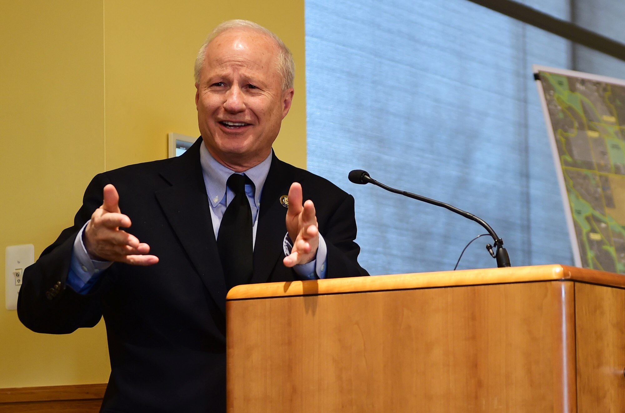 U.S. Rep. Mike Coffman (R-CO), serving the 6th District of Colorado, speaks to Arapahoe County citizens during a Readiness and Environmental Protection Integration program celebration March 9, 2016, at the Arapahoe Center Point Plaza in Aurora, Colo. The Compatible Use Buffer Project provided connectivity of natural resources and recreational trails around the base, supporting new and existing regional planning objectives. (U.S. Air Force photo by Senior Airman Racheal E. Watson/Released)