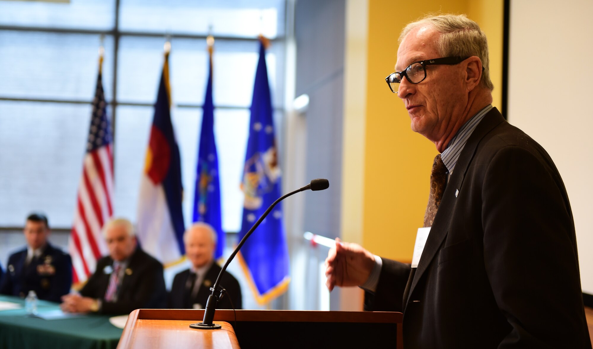 Mayor Steve Hogan, of the City of Aurora, talks to Arapahoe County citizens during a Readiness and Environmental Protection Integration program celebration March 9, 2016, at the Arapahoe Center Point Plaza in Aurora, Colo. The event celebrated the recognition of the first land buffer acquisition under the Buckley Air Force Base Compatible Use Buffer Program. (U.S. Air Force photo by Senior Airman Racheal E. Watson/Released)