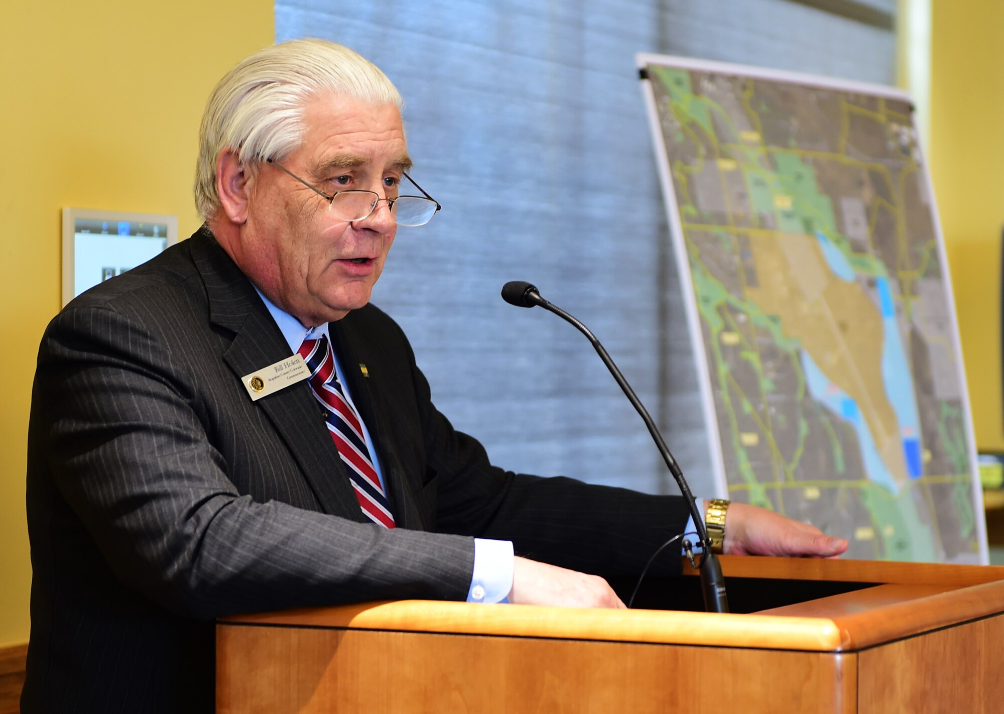 Bill Holen, Arapahoe County commissioner, speaks during a Readiness and Environmental Protection Integration program celebration March 9, 2016, at the Arapahoe Center Point Plaza in Aurora, Colo. As part of the REPI project, a corridor for parks, trails and wildlife habitats will be created around the facility. (U.S. Air Force photo by Senior Airman Racheal E. Watson/Released)