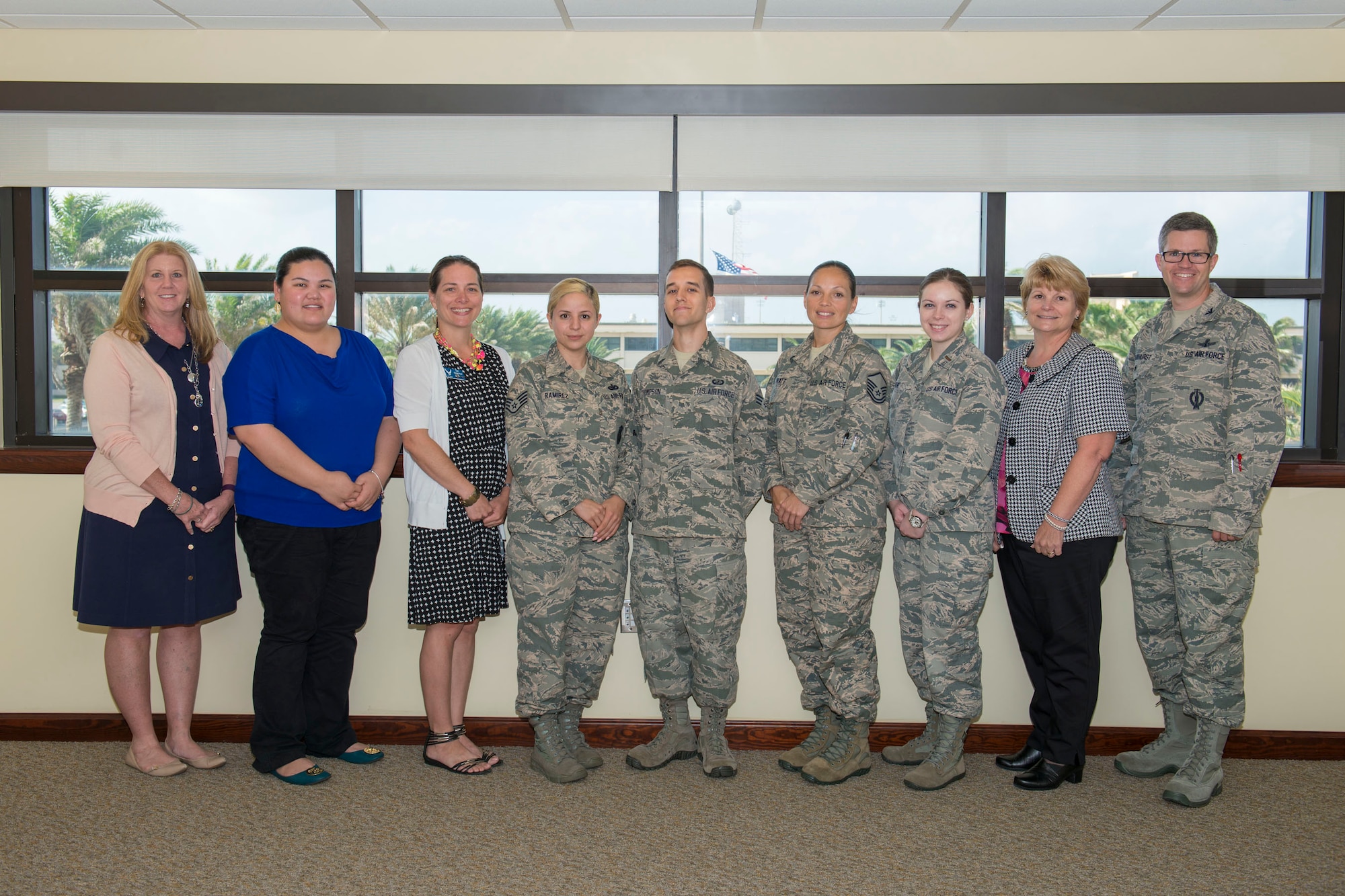 Col. Shawn Fairhurst, 45th Space Wing vice commander, far right, poses with 14 recent graduates of the 45th SW Resiliency Training Assistant Course after congratulating them for joining the installation's Resiliency Team. The RTA graduates will provide resilience training to Total Force Airmen, civilian personnel and families at the unit level, and with Master Resiliency Trainers through professional military education, Wingman Day and special events.  (U.S. Air Force photo/Benjamin Thacker) (Released)
