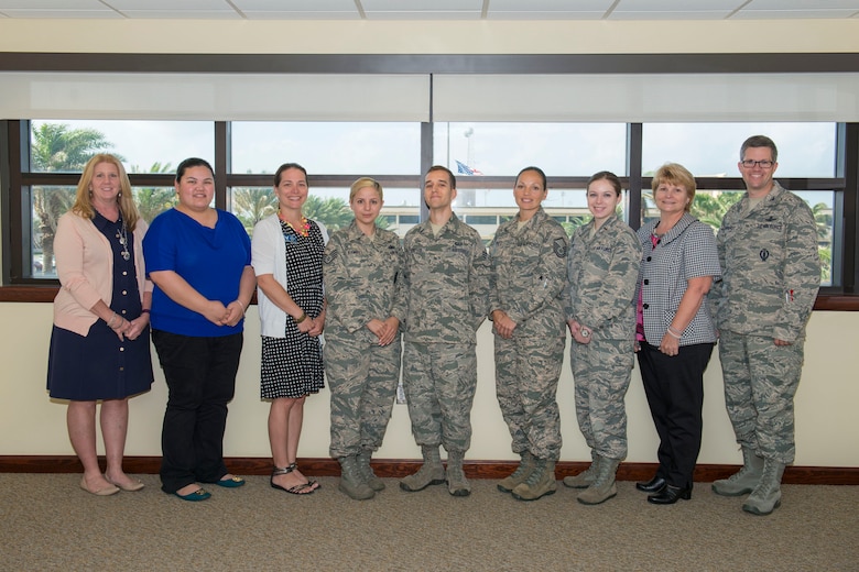 Col. Shawn Fairhurst, 45th Space Wing vice commander, far right, poses with 14 recent graduates of the 45th SW Resiliency Training Assistant Course after congratulating them for joining the installation's Resiliency Team. The RTA graduates will provide resilience training to Total Force Airmen, civilian personnel and families at the unit level, and with Master Resiliency Trainers through professional military education, Wingman Day and special events.  (U.S. Air Force photo/Benjamin Thacker) (Released)
