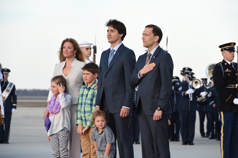 Canadian Prime Minister Justin Trudeau, his family and Peter Selfridge (right), U.S. State Department’s Chief of Protocol, stand for the U.S. and Canadian national anthems at Joint Base Andrews, Md., March 9, 2016. Trudeau’s visit is the first time in approxiamtely 20 years a Canadian Prime Minister has arrived in the U.S. (U.S. Air Force photo by Senior Airman Joshua R. M. Dewberry/RELEASED)
