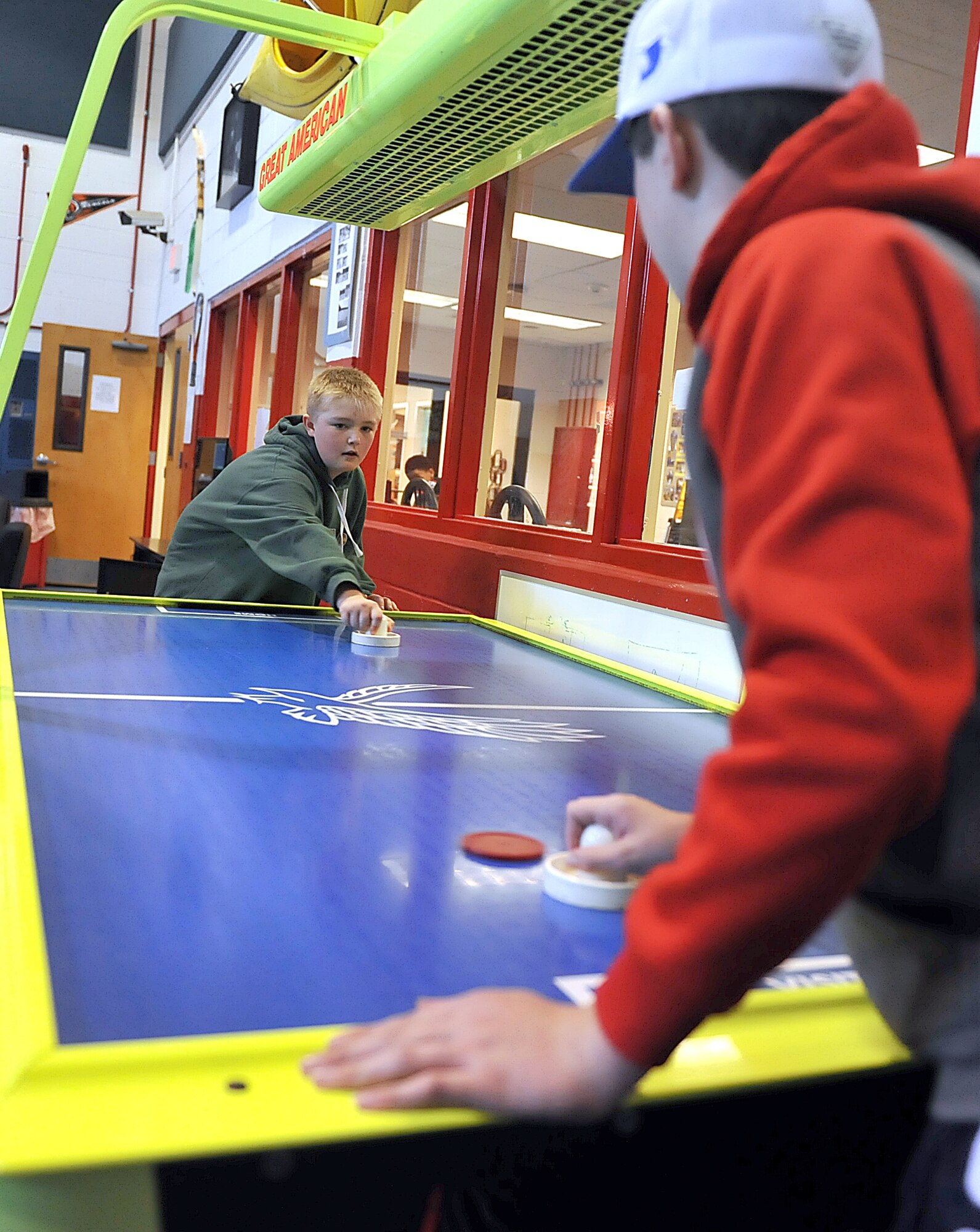Brayden Wise, and Dominyck Sotak, both 12-year olds, enjoy a game of air hockey at the Robins Air Force Base Youth Center. (U.S. Air Force photo by Tommie Horton)
