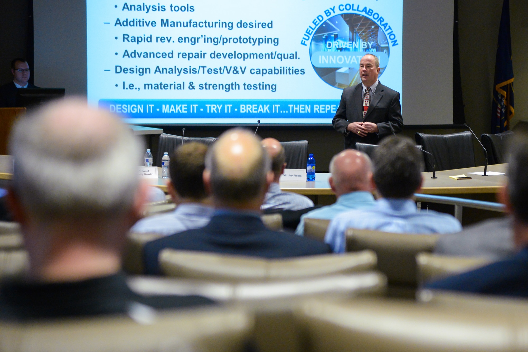 Wayne Ayer, technical director of the Air Force Sustainment Center Engineering and Technical Management Directorate, brief potential partners from industry, government and academia on the AFSC plan for Innovation Centers at Hill Air Force Base and AFSC's other logistics complexes during a Partnership Symposium March 11. AFSC wants to create agile manufacturing capabilities and collaboration that will improve aircraft maintenance now and in the future. The initiative is the result of a successful pilot
program started at Hill in 2015. (Air Force photo by R. Nial Bradshaw)
