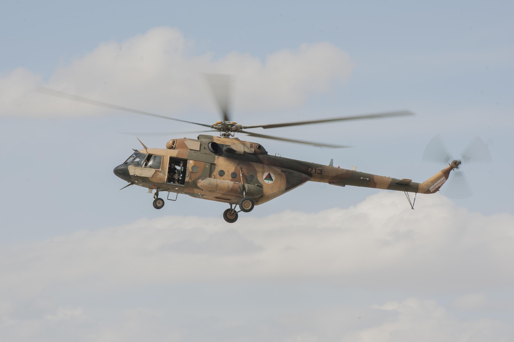 An Afghan Air Force Mi-17 flies over Kandahar Airfield, Afghanistan, March 2, 2016. Members of the AAF work closely with Train Advise Assist Command - Air, a U.S. run functional command, that assists our Afghan partners to develop a professional, capable and sustainable force. (U.S. Air Force photo/Tech. Sgt. Robert Cloys)
