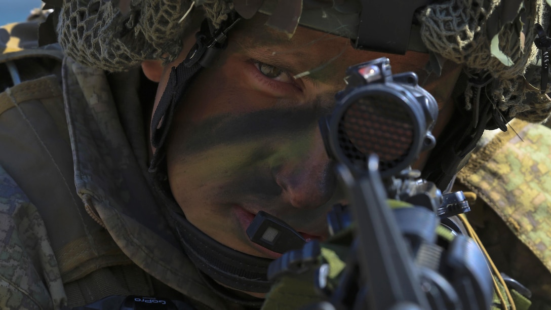 New Zealand Soldier Lt. Harry Fenwick with 161st New Zealand Battery, provides cover during an amphibious assault, on Doksukri Beach, Republic of Korea, March 11, 2016, for Exercise Ssang Yong 16. Ssang Yong is a biennial military exercise focused on strengthening the amphibious landing capabilities of the ROK, the U.S., New Zealand and Australia.