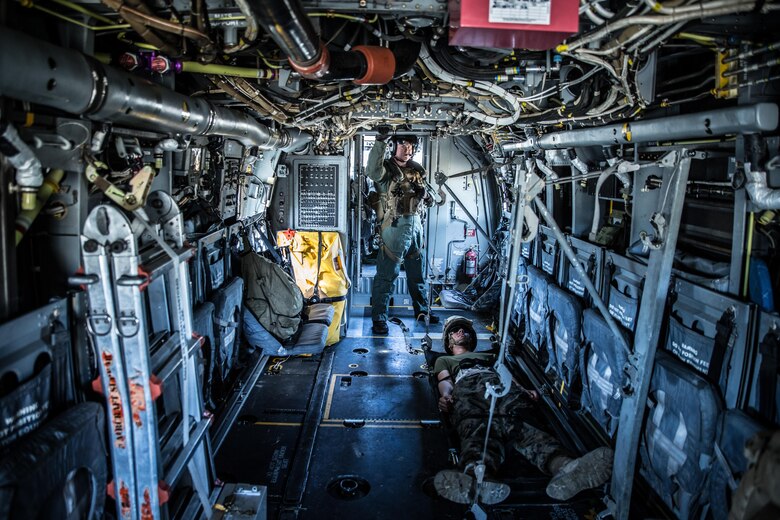Cpl. Austin Meekins, a crew chief with Marine Tiltrotor Squadron 365, waits inside a MV-22Osprey to take the injured evacuee to a medical treatment facility during a casualty evacuation exercise at Landing Zone Penguin at Camp Lejeune, N.C., March 10, 2016. The training allowed Marines with Marine Medium Tiltrotor Squadron 365 and 2nd CEB to train together in order to be well prepared to conduct a successful CASEVAC in any situation they may encounter while deployed, to ultimately save lives.  (U.S. Marine Corps photo by Lance Cpl. Erick Galera/Released)