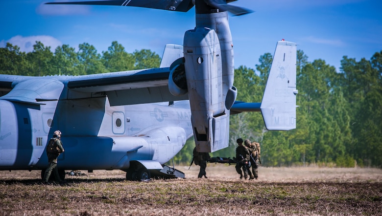 Marines with 2nd Combat Engineer Battalion, load a casualty onto an MV-22B Osprey during a casualty evacuation exercise at Landing Zone Penguin at Camp Lejeune, N.C., March 10, 2016. The training allowed Marines with Marine Medium Tiltrotor Squadron 365 and 2nd CEB to train together in order to be well prepared to conduct a successful CASEVAC in any situation they may encounter while deployed, to ultimately save lives.  (U.S. Marine Corps photo by Lance Cpl. Erick Galera/Released)