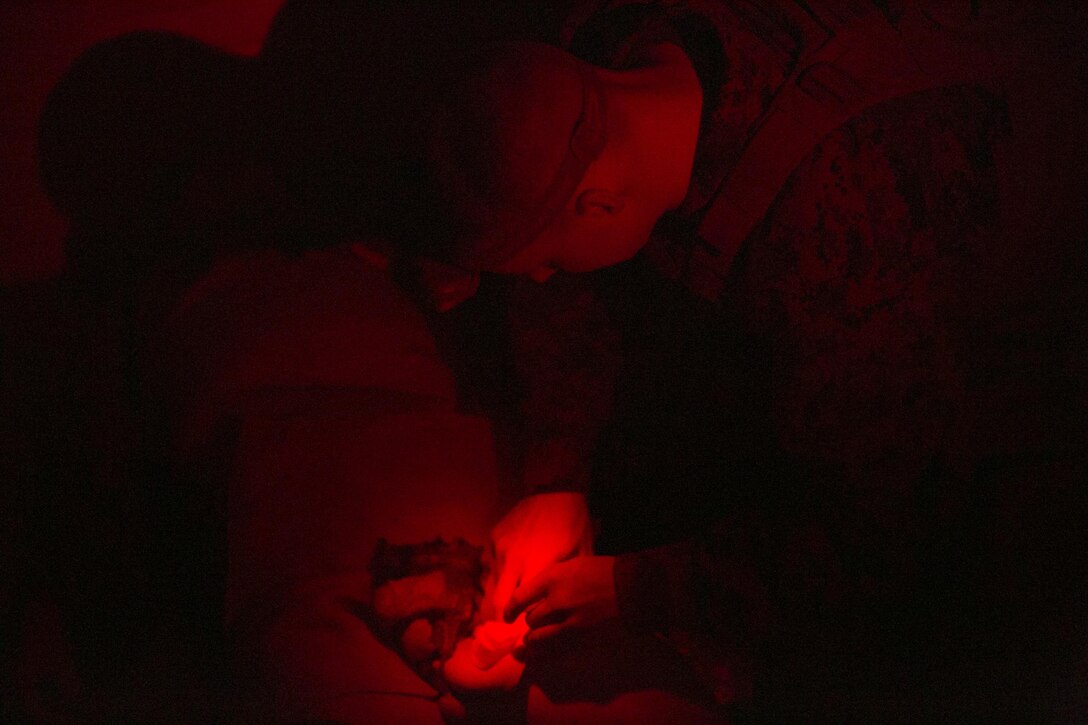 A Marine attempts to stop a simulated casualty from bleeding out from an abdominal laceration by applying bandages at Camp Lejeune N.C., March 10, 2016. Improvised explosive devices increase the risk of multiple-casualty situations due to their large area of impact. To prepare for a situation in which a corpsman needs assistance, treating injured Marines quickly, Marines go through the combat life-saver course to be able to provide similar life-saving care that a corpsman would administer. (U.S. Marine Corps photo by Lance Cpl. Luke Hoogendam/Released.)