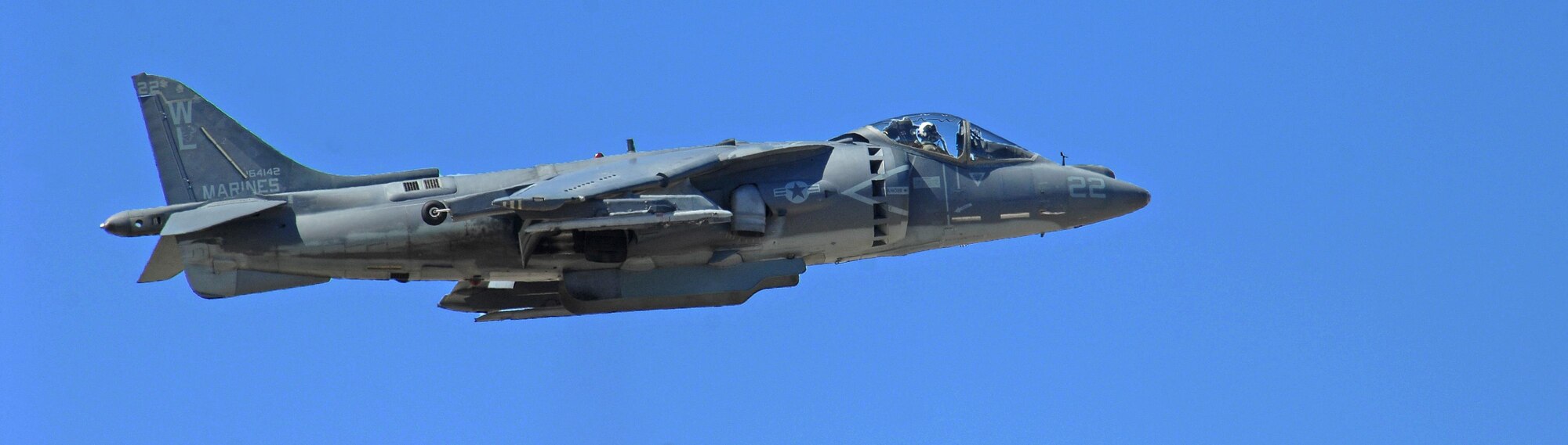 U.S. Marine Corp Harrier II hovers in front of spectators during the Thunder and Lightning over Arizona Open House at Davis-Monthan Air Force Base, Ariz., March 12, 2016. The Harrier II thrusts 22,000 pounds in order to hover like a helicopter and blast forward like a jet at near-supersonic speeds. (U.S. Air Force photo by Senior Airman Camilla Elizeu/Released)