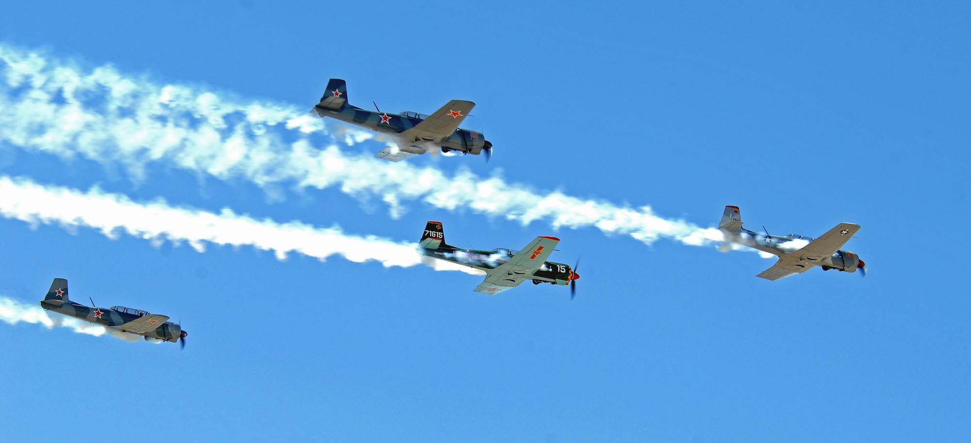 The Desert Rats Warbirds fly in a formation during the Thunder and Lightning over Arizona Open House at Davis-Monthan Air Force Base, Ariz., March 12, 2016. The Open House featured aerial demonstrations from various teams and numerous static displays allowing the public to gain a better understanding of the Air Force. (U.S. Air Force photo by Senior Airman Camilla Elizeu/Released) 