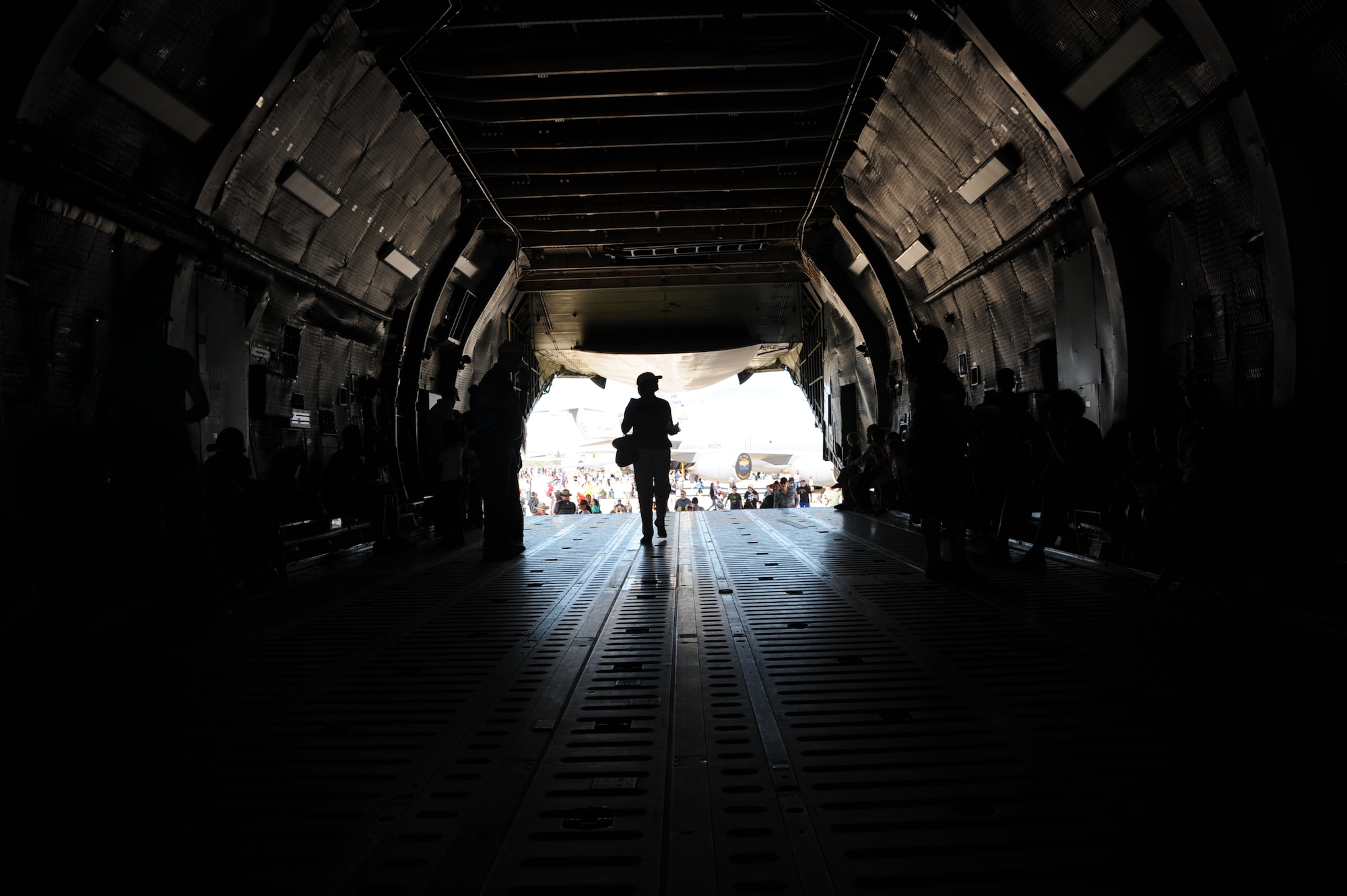 A Thunder and Lightning over Arizona Open House patron walks through a C-5 Galaxy at Davis-Monthan Air Force Base, Ariz., March 13, 2016. The C-5 was on display to Open House guests as well as 50 other aircraft static displays showcased a day.(U.S. Air Force photo by Airman Nathan H. Barbour/Released)