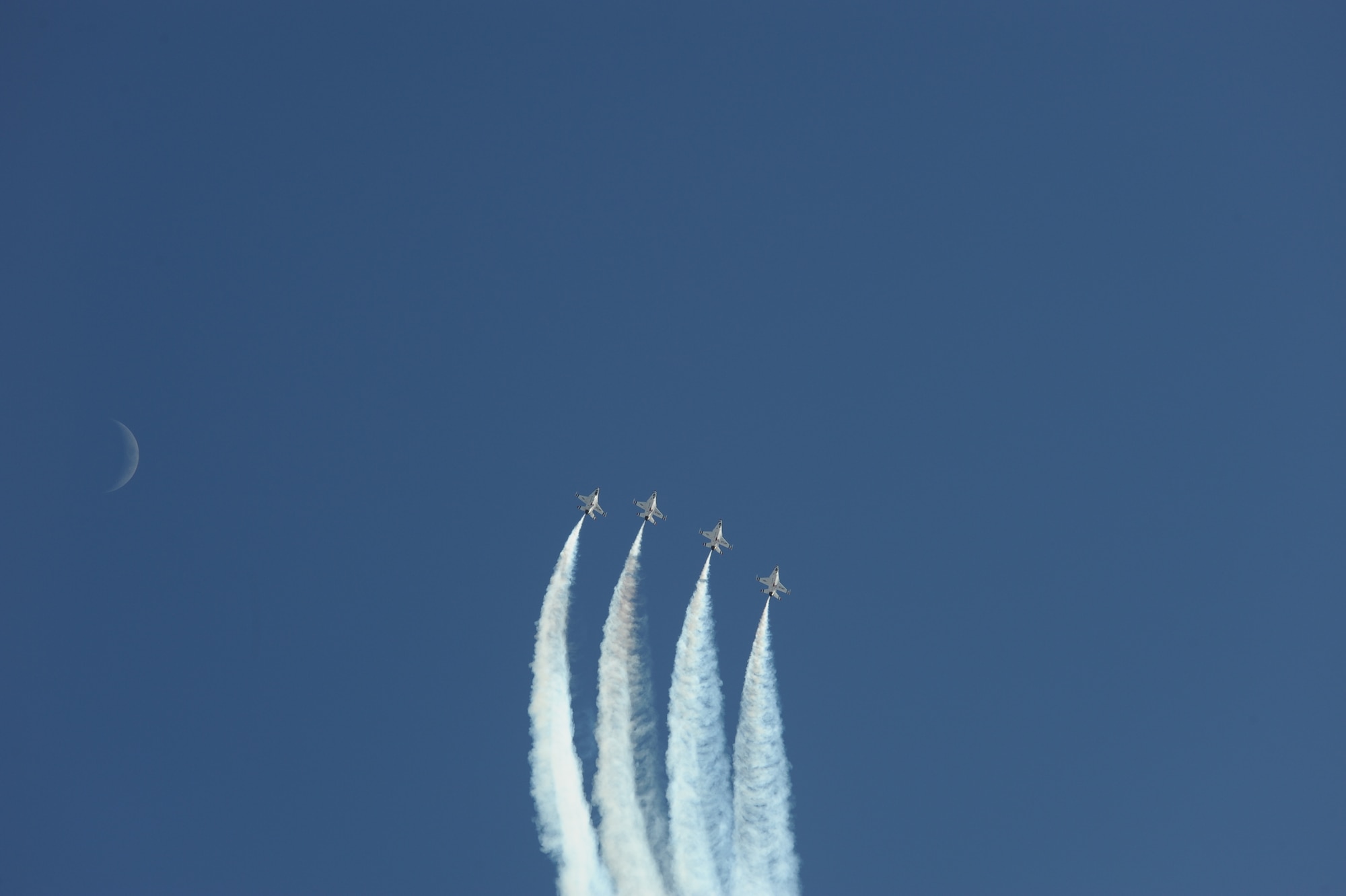 The U.S. Air Force Air Demonstration Squadron, the Thunderbirds, performs aerial maneuvers during the Thunder and Lightning over Arizona Open House at Davis-Monthan Air Force Base, Ariz., March 13, 2016. The aerial demonstrations exhibited some of the maximum capabilities of the F-16 Fighting Falcon, the Air Force’s premier multi-role fighter jet. For each Thunderbirds F-16 aircraft that travels, a crew chief and an assistant crew chief are assigned to it, ensuring their jet is always mission-ready. (U.S. Air Force photo by Airman Nathan H. Barbour/Released)