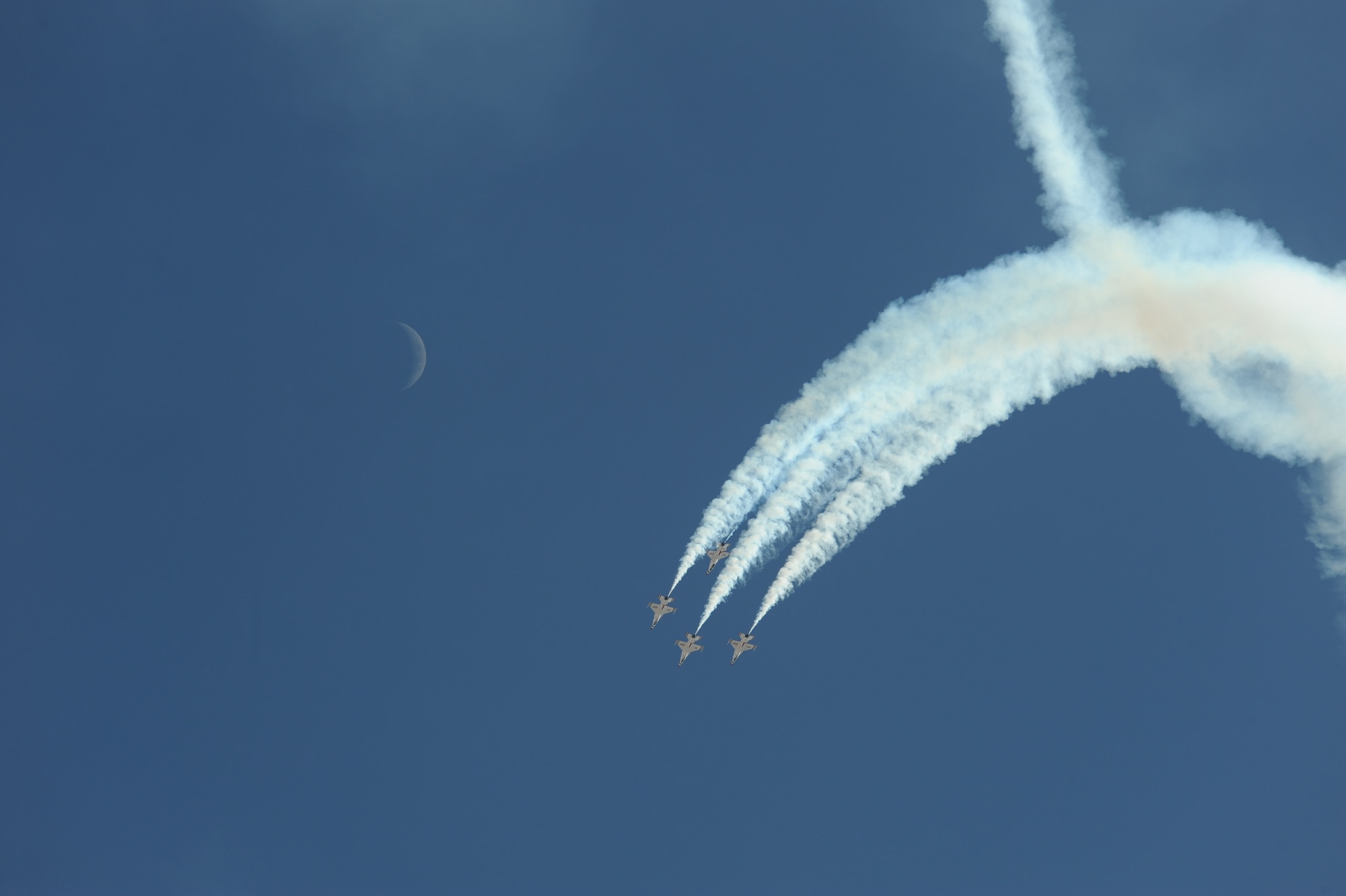 The U.S. Air Force Air Demonstration Squadron, the Thunderbirds, performs aerial maneuvers during the Thunder and Lightning over Arizona Open House at Davis-Monthan Air Force Base, Ariz., March 13, 2016. The aerial demonstrations exhibited some of the maximum capabilities of the F-16 Fighting Falcon, the Air Force’s premier multi-role fighter jet. For each Thunderbirds F-16 aircraft that travels, a crew chief and an assistant crew chief are assigned to it, ensuring their jet is always mission-ready. (U.S. Air Force photo by Airman Nathan H. Barbour/Released)