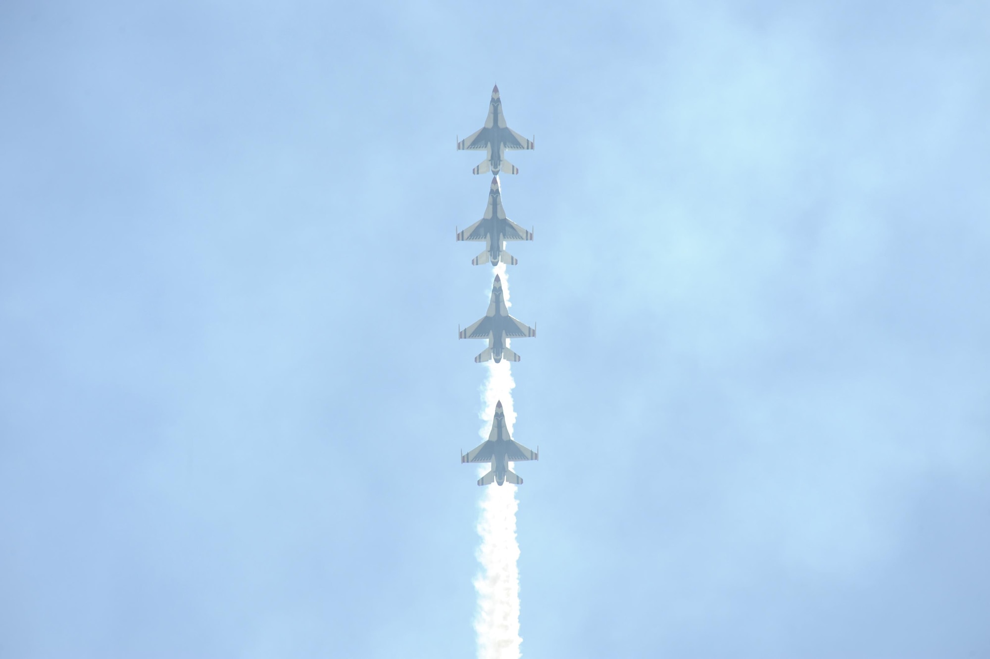 The U.S. Air Force Air Demonstration Squadron, the Thunderbirds, performs aerial maneuvers during the Thunder and Lightning over Arizona Open House at Davis-Monthan Air Force Base, Ariz., March 13, 2016. The aerial demonstrations exhibited some of the maximum capabilities of the F-16 Fighting Falcon, the Air Force’s premier multi-role fighter jet. For each Thunderbirds F-16 aircraft that travels, a crew chief and an assistant crew chief are assigned to it, ensuring their jet is always mission-ready. (U.S. Air Force photo by Airman Nathan H. Barbour/Released)