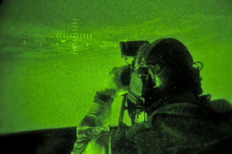 A picture of German armed forces Capt. Sebastian Pflueger, joint terminal attack controller (JTAC) with the 26th Airborne Regiment in Zweibrücken, Germany, operating a range finder inside the Air National Guard Advanced JTAC Training System.