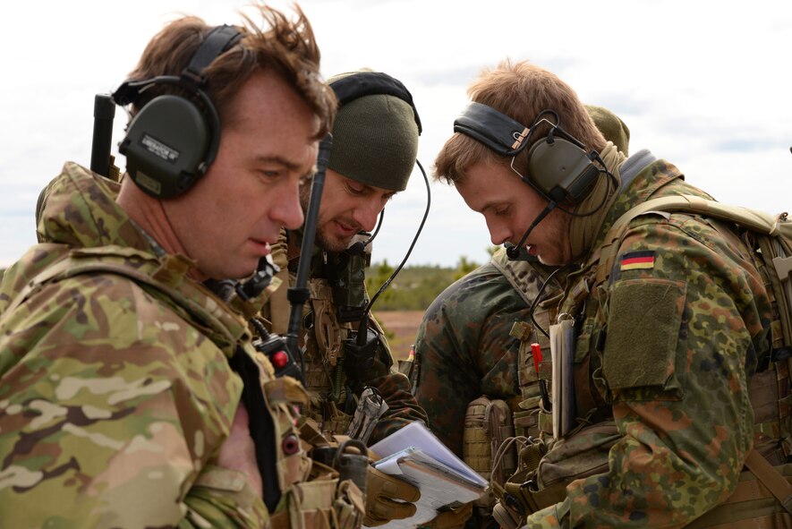 From left, U.S. Air Force Tech. Sgt. Chris Donohue, Joint Terminal Attack Controller (JTAC) with the 227th Air Support Operations Squadron (ASOS), and German armed forces JTACs 1st Lt. Marius Sokol and 2d Lt. Michael Barthel perform close air support training at the Warren Grove Bombing Range in Ocean County, N.J. on Feb. 25, 2016. The German armed forces JTACs partnered with the 227th ASOS, from the New Jersey Air National Guard???s 177th Fighter Wing, for a five day combined training exercise which included an F-16 familiarization brief and training in the 227th's new $1.2 million Air National Guard Advanced JTAC Training System.  (U.S. Air National Guard photo by Master Sgt. Andrew J. Moseley/Released)